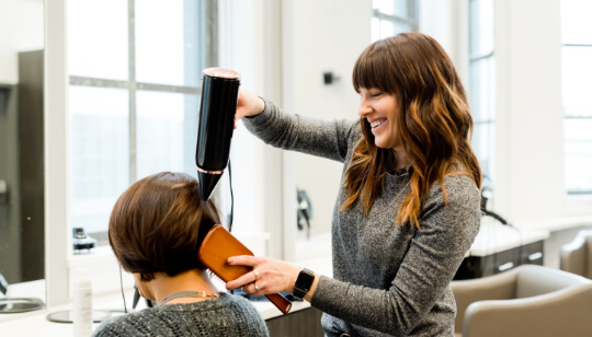 Hair stylist with client.