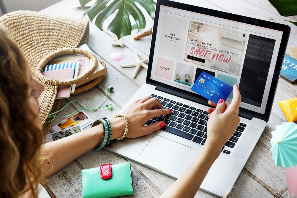 Female uses credit card to place an online shopping order
